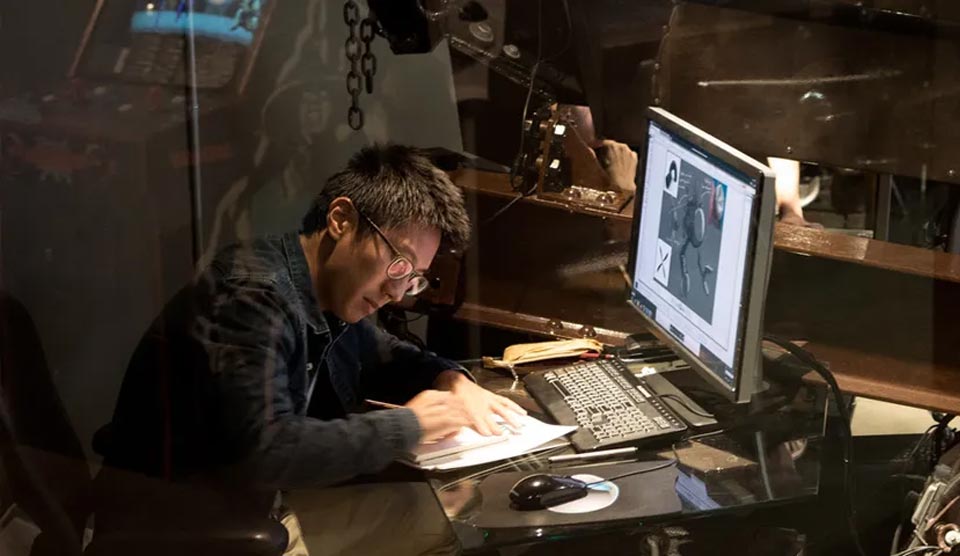 A team working on computers in an office setting.